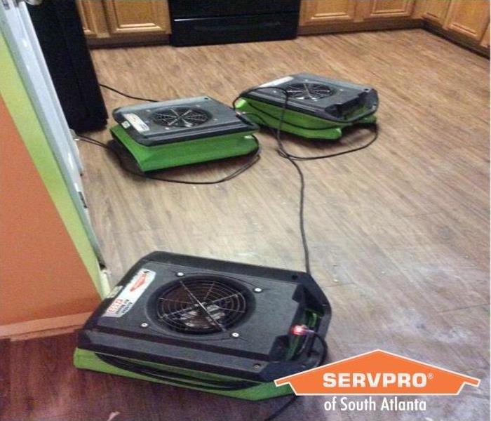 SERVPRO Air movers drying hardwood floors