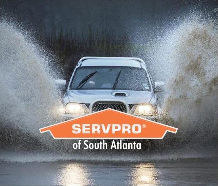 SUV driving through high water levels