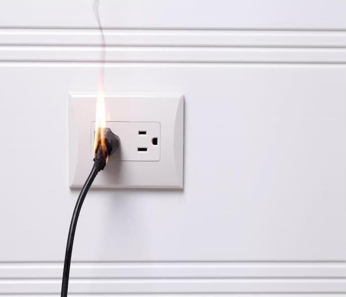 outlet with plug plugged in while on fire