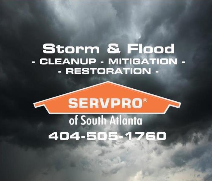 Stormy sky backdrop with SERVPRO of South Atlanta Logo